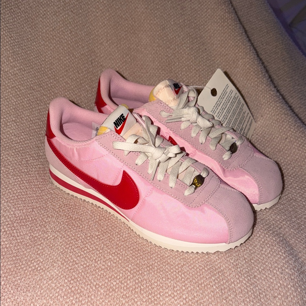 Nike Women’s Pink Sneakers with Red Swoosh